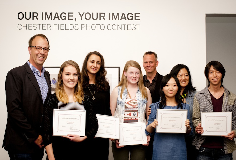 North Vancouver City Councillor Craig Keating (left), with Director/Curator Reid Shier (fourth from right), Minister Naomi Yamamoto (second from right) and the winners of this year's Chester Fields Photo Contest. Photo: Rachel Topham. Courtesy Rachel Topham Photography