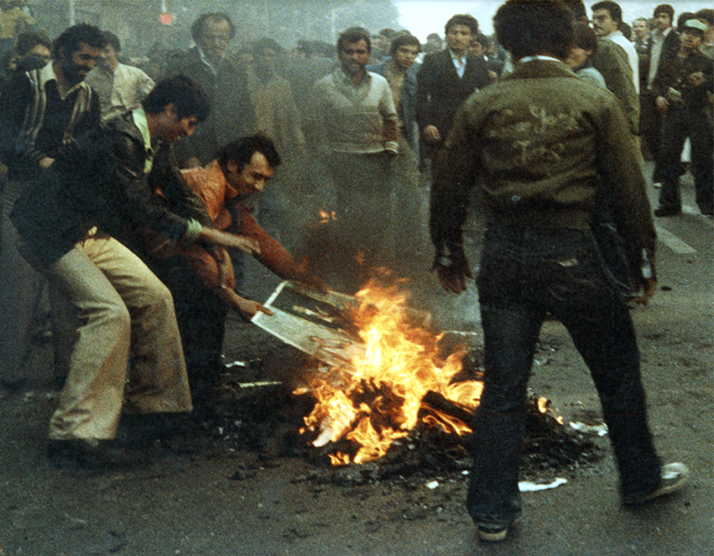 Shah's photographs being burnt for the first time. Autumn 1979.