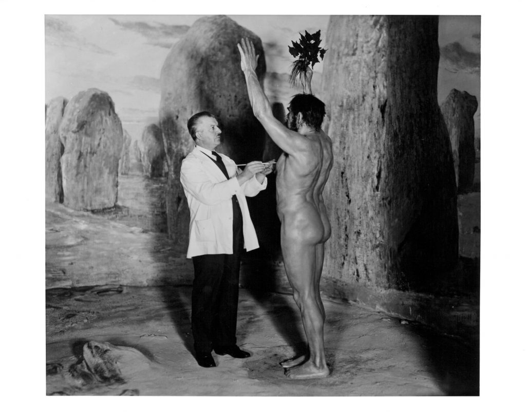 Artist Frederick blaschke putting finishing touches on Neolithic Sun Worship diorama figure at The Field Museum of Natural History, Chicago. 1930. Photograph by museum staff photographer Charles Carpenter. From the exhibition Camera Obscured: Photographic Documentation and the Public Museum. Photograph courtesy The Field Museum of Natural History, Chicago.