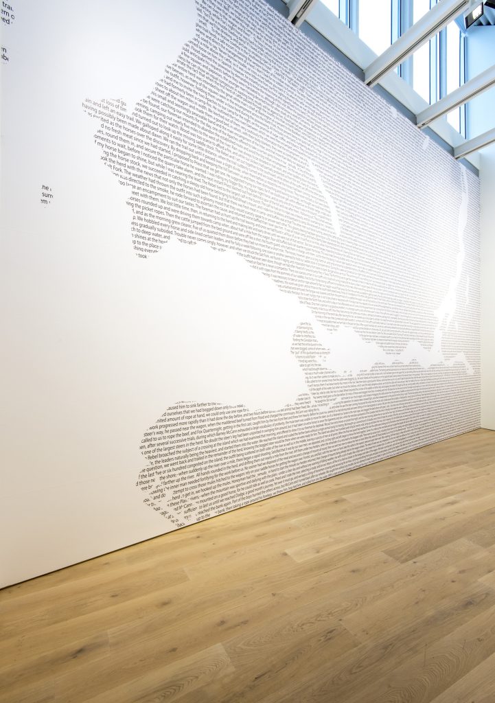 Installation view, Jordan Abel, "Cartography (12)", 2017, text on vinyl, 816 x 538 cm
