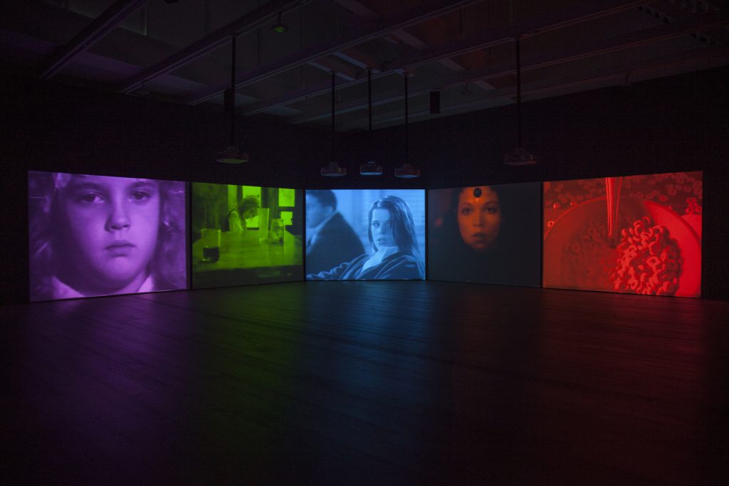 Installation view, Susan Hiller, "Psi Girls", 1999, five-screen video installation with sound, © Susan Hiller; courtesy Lisson Gallery