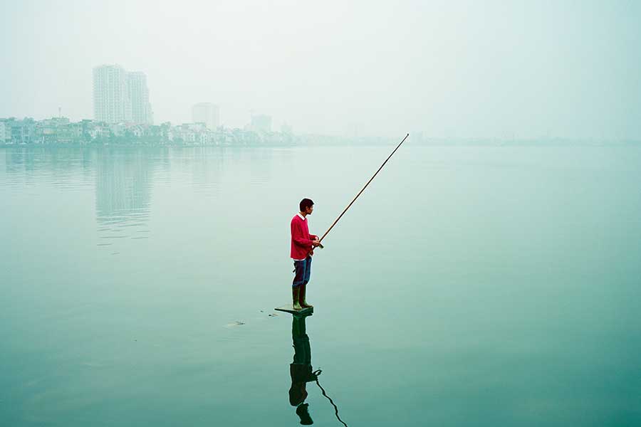Greg Girard, Man in Red Sweater Fishing, West Lake, 2010